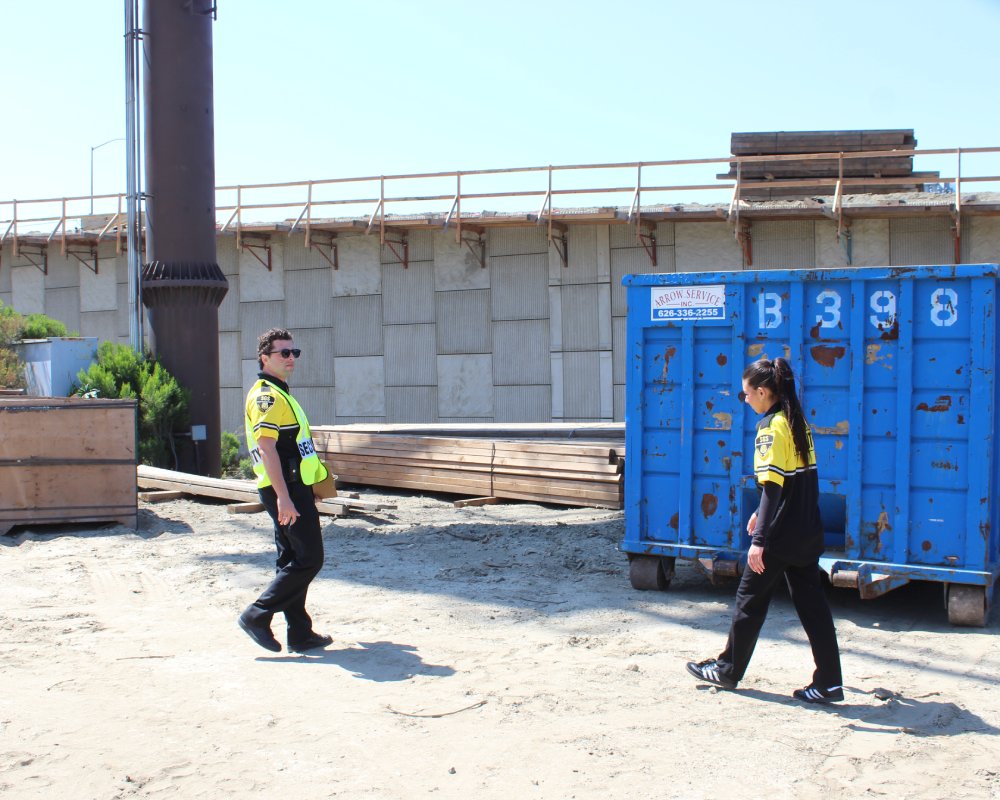 two security guards patrolling on a site